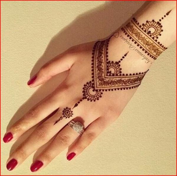 Image of Baby girl hand with mehndi design-PO099281-Picxy